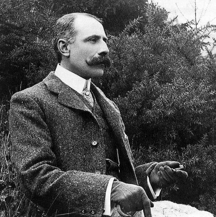 image of a middle aged man in late Victorian clothes, viewed in right semi-profile. He has a prominent Roman nose and large moustache