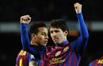 FC Barcelona's Lionel Messi, from Argentina, reacts after scoring against Granada during a Spanish La Liga soccer match at the Camp Nou stadium in Barcelona, Spain, Tuesday, March 20, 2012.