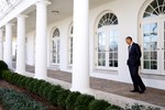 File - President Barack Obama walks on the Colonnade of the White House on his way to the Oval Office, Feb. 12, 2013.