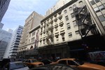 In this file photo of Thursday, May 6, 2010, traffic passes a building in lower Manhattan that once housed a Burlington Coat Factory store, in New York. A 13-story mosque and Islamic cultural center is planned to replace the building that was damaged by airplane debris on Sept. 11, 2001.