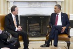 Secretary-General Ban Ki-moon (left) meets with United States President Barack Obama at the White House, in the Oval Office, 11 April, 2013.