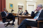 President Barack Obama talks on the phone with FBI Director Robert Mueller to receive an update on the explosions that occurred in Boston, in the Oval Office, April 15, 2013. Seated with the President are Lisa Monaco, Assistant to the President for Homeland Security and Counterterrorism, and Chief of Staff Denis McDonough. (Official White House Photo by Pete Souza)This official White House photograph is being made available only for publication by news organizations and/or for personal use printing by the subject(s) of the photograph. The photograph may not be manipulated in any way and may not be used in commercial or political materials, advertisements, emails, products, promotions that in any way suggests approval or endorsement of the President, the First Family, or the White House.