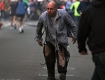 In this photo provided by The Daily Free Press and Kenshin Okubo, people react to an explosion at the 2013 Boston Marathon in Boston, Monday, April 15, 2013.