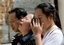 Relatives of one of more then 1,000 students killed by the May 12 earthquake at Beichuan Middle School grieve at the badly stricken town of Qushan in Beichuan County of Sichuan province Thursday June 5, 2008.