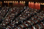 Lawmakers wait for the results of the fourth round of voting to elect the nation's new president, in Rome's Lower Chamber, Friday, April 19, 2013.