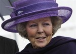 In this Sept. 30, 2008 file photo Dutch Queen Beatrix smiles as she arrives for the opening of cold mill 22 at Corus steel factory in IJmuiden, western Netherlands.