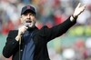 This April 20, 2013 file photo shows Neil Diamond singing "Sweet Caroline" in the eighth inning of a baseball game between the Boston Red Sox and the Kansas City Royals in Boston. Sales for Neil Diamond's Sweet Caroline are up by 597 percent a week after the tune has become a source of comfort following bombings in Boston last week.