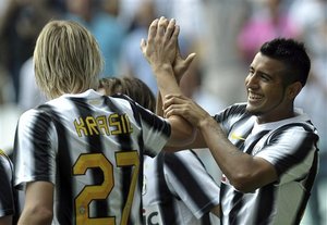 Juventus Chilean forward Arturo Vidal, right, celebrates with his teammate Milos Krasic after scoring, during a Serie A soccer match between Juventus and Parma at the Juventus Stadium in Turin, Italy, Sunday, Sept. 11, 2011.