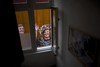 An image of Dutch Queen Beatrix and her son Crown Prince Willem-Alexander is photographed from the window of an empty room in downtown Amsterdam, Netherlands Monday, April 29, 2013. Queen Beatrix has announced she will relinquish the crown on April 30, 2013, after 33 years of reign, leaving the monarchy to her son Crown Prince Willem Alexander.