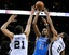 Oklahoma City Thunder's Kevin Durant (35) shoots between San Antonio Spurs' Tim Duncan (21) and Kawhi Leonard during the second half of an NBA basketball game, Monday, March 11, 2013, in San Antonio. San Antonio won 105-93. (AP Photo/Darren Abate)