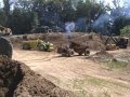 3 Euclid articulated off-road dump trucks work the pit with a B61 Mack...