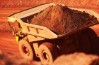 An increase in iron ore shipments helped Australia return to a trade surplus.