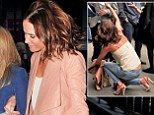 That was a close call! Sophie Anderton nearly takes a tumble as she steps outside for cigarette break at art show 