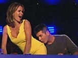 Pucker up: Simon Cowell plants a big kiss on Amanda Holden's bottom during Saturday nights episode of Britian's Got Talent 