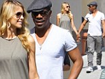 Holding hands: Eddie Murphy and girlfriend Paige Butcher locked fingers on Friday while walking in Beverly Hills