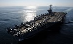 The Nimitz-class aircraft carrier USS John C. Stennis (CVN 74) steams through the Straits of Hormuz.