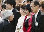 File- Japanese Emperor Akihito, left, speaks with Japanese scientist Sinya Yamanaka of Kyoto University during the annual spring garden party hosted by the emperor and empress in Tokyo Caption here in Tokyo, Japan, Thursday, April 16, 2009. Standing from left are: Osaka Prefectural Gov. Toru Hashimoto and his wife, Noriko, Jaapanese actress Kaori Momoi.