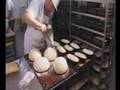 Bakerman is baking bread - a master baker at work