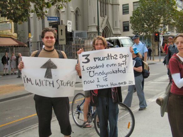 Protesters with grossly mis-spelled placards