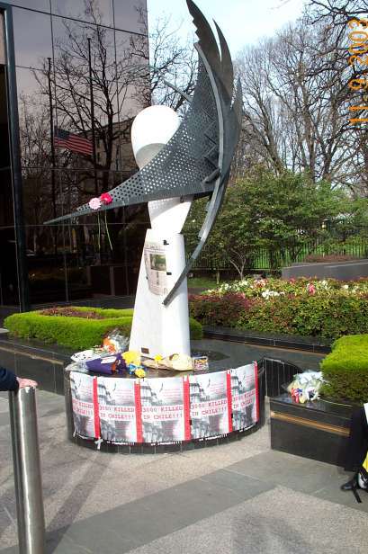 Poster ring base of sculpture outside Consulate