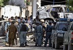 Afghan and U.S. soldiers arrive to the scene where a suicide car bomber attacked a NATO convoy in Kabul, Afghanistan, Thursday, May 16, 2013.