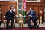 Thomas de Maizière, German Minister of Defense, with Balkh Governor Atta Muhammad Nur in 2010. U.S. Senator John Kerry at Balkh University in May 2011.