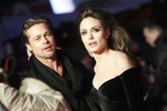 U.S. actors Angelina Jolie, right, and Brad Pitt arrive at the European premier of the movie "The Tourist" in Berlin on Tuesday, Dec. 14, 2010.