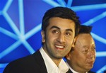 Bollywood actor Ranbir Kapoor, left, and Panasonic India Chief Executive Officer Daizo Ito look on at an event to announce Kapoor as brand ambassador for Panasonic's VIErA LCD and plasma televisions and home theatres, in New Delhi, India, Saturday, April 4, 2008.