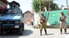 Indian paramilitary troops stand guard during a strike in Srinagar, the summer capital of Indian Kashmir, on 21 May 2013. Most shops, businesses and schools were closed across Indian-controlled Kashmir on 21 May during an all-day strike called by separatist group Awami Action Committee, to mark the deaths of two key Kashmiri leaders. Mirwaiz Mohammad Farooq, chief cleric of Indian-held Kashmir, was killed by unknown assailants in 1990. Abdul Ghani Lone, was gunned down at a rally held to observe the anniversary of Farooq's death in 2002.