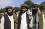 In this image taken on Oct. 4, 2009, Pakistan's new Taliban leader Hakimullah Mehsud, center, stands pose with his deputy Waliur Rehman, left, and spokesman Azam Tariq in Sararogha in Pakistani tribal area of South Waziristan along Afghanistan border.