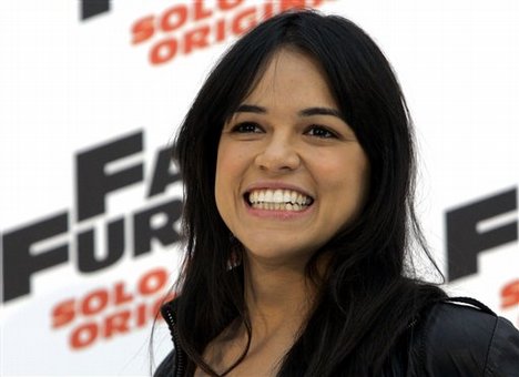 US actress Michelle Rodriguez poses for photographers at a photocall for the film "Fast & Furious", in Rome, Wednesday March 25, 2009.