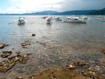 The beach of Sabang, Puerto Princesa, Palawan is rocky but with very clear waters.