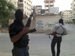 File - In this Thursday, June 28, 2012 photo, embers of the Free Syrian Army are seen in a neighborhood of Damascus, Syria. Much of the violence that has gripped Syria has been sanctioned by the government to crush dissent.