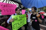 Demonstrators hold signs supporting Edward Snowden in New York's Union Square Park, Monday, June 10, 2013.