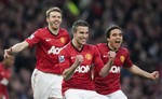 Manchester United's Robin van Persie, centre, celebrates after scoring against Aston Villa during their English Premier League soccer match at Old Trafford Stadium, Manchester, England, Monday April 22, 2013.