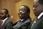 Zimbabwean Prime Minister Morgan Tsvangirai, centre, addresses a press conference, in Harare, Thursday, May, 21, 2009.