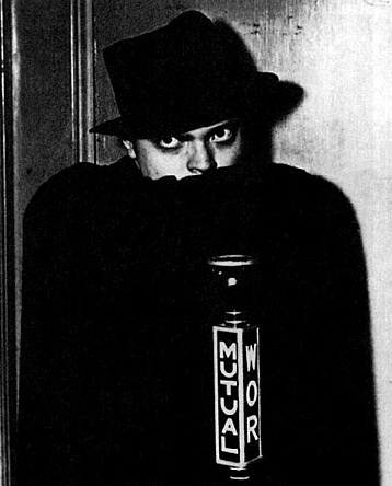 Promotional photograph of Orson Welles dressed as The Shadow, dated 1937 or 1938.