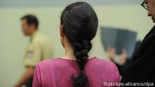 A shot of Beate Zschäpe, taken from behind her, in court on 18.06.13 in Munich. (Photo via Andreas Gebert/dpa)