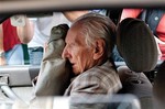 FILE - In this July 18, 2012 file picture alleged Hungarian war criminal Laszlo Csatary sits in a car as he leaves the Budapest Prosecutor's Office after he was questioned by detectives on charges of war crimes during WWII and prosecutors ordered his house arrest in Budapest, Hungary.