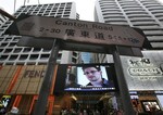 A TV screen shows a news report of Edward Snowden, a former CIA employee who leaked top-secret documents about sweeping U.S. surveillance programs, at a shopping mall in Hong Kong Sunday, June 23, 2013.