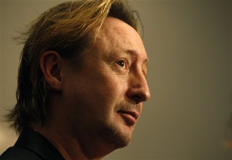 Julian Lennon, son of late Beatles legend John Lennon, is shown during an interview at the media preview for his photography exhibit, Tuesday, Nov. 30, 2010 in Miami. The exhibition called "Timeless" features about 30 of Lennon's hand-signed portrait and landscape photographs and will run Dec. 1-5 at Miami's Adrienne Arsht Center for the Performing Arts.