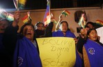 Supporters of Bolivia's President Evo Morales shout slogans and wave Bolivian flags with a sign that reads in Spanish "Bolivia dignified and sovereign" as they protest outside France's embassy in La Paz, Bolivia, Tuesday, July 2, 2013.