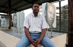 File: In this Thursday, Dec. 27, 2012 photo, former President Nelson Mandela's grandson, Mandla Mandela, waits for an interview with the Associated Press at Mandela's birthplace, Mvezo, in the Eastern Cape province.