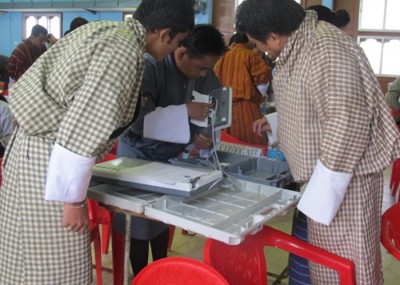 Last check: Polling officials in Samtse check the EVM before they leave for polling stations 