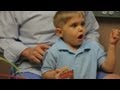 Amazing moment deaf three-year-old boy hears for the first time