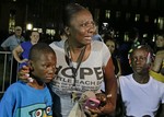 Darrsie Jackson, center, reacts after hearing the verdict of not guilty in the trial of George Zimmerman with her children Linzey Stafford, left, 10, and Shauntina Stafford, 11, at the Seminole County Courthouse, Saturday, July 13, 2013, in Sanford, Fla.