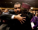 Dexter Scott King hugs a friend at the conclusion of funeral services for his mother, Coretta Scott King at the New Birth Missionary Baptist Church in Lithonia, Ga., Feb. 7, 2006. Coretta Scott King was the wife of Dr. Martin Luther King Jr.