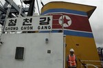 Panamanian presidential security detail walks on the deck aboard a North Korean-flagged ship at the Manzanillo International container terminal on the coast of Colon City, Panama, Tuesday, July 16, 2013.