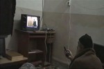 In this undated image from video seized from the walled compound of al-Qaida leader Osama bin Laden in Abbottabad, Pakistan, and released Saturday, May 7, 2011 by the U.S. Department of Defense a man, who the American government identified as Osama bin Laden, watches television, showing an image of U.S. President Barack Obama.