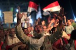 A supporter of Egypt's ousted President Mohammed Morsi chants slogans during a protest outside Rabaah al-Adawiya mosque, where protesters have installed a camp and hold daily rallies at Nasr City in Cairo, Egypt, Sunday, Aug. 4, 2013.